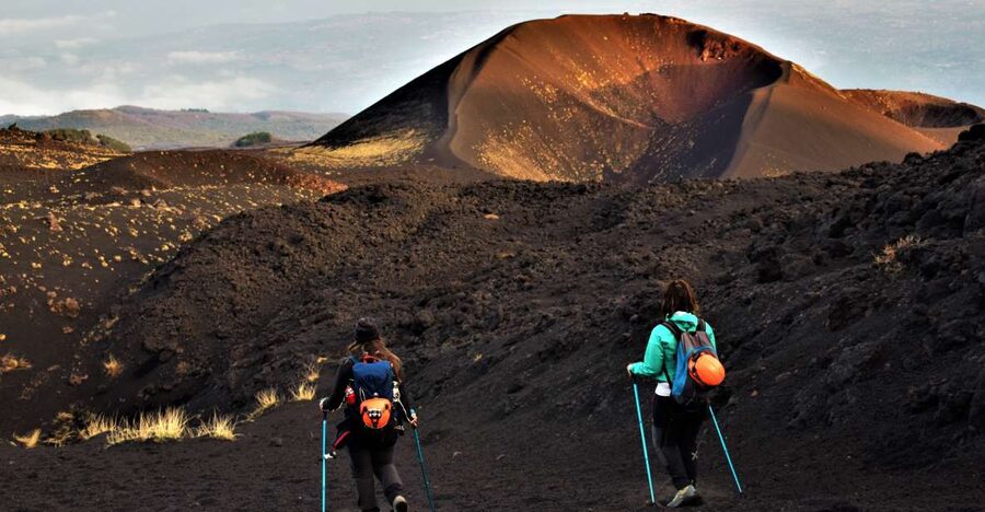 Catania: Etna Morning or Sunset Trek with Lava Tunnel & Gear - Walking into Etna’s black volcanic world