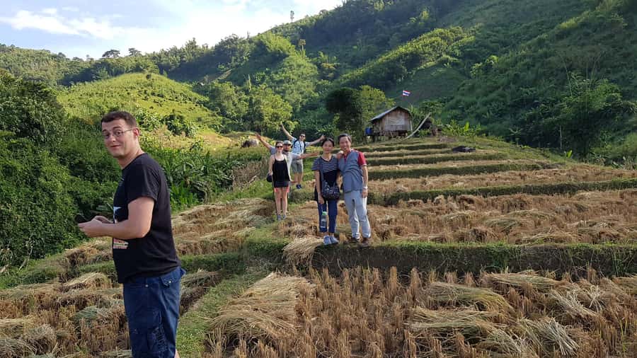 Chiang Rai 1 Day Jungle Trek with Bamboo Lunch & Local Guide - Making lunch inside a bamboo tube