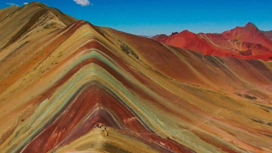 Cusco: Full-Day Rainbow Mountain & Red Valley Trekking Tour - Climbing to Rainbow Mountain at 5,036 meters