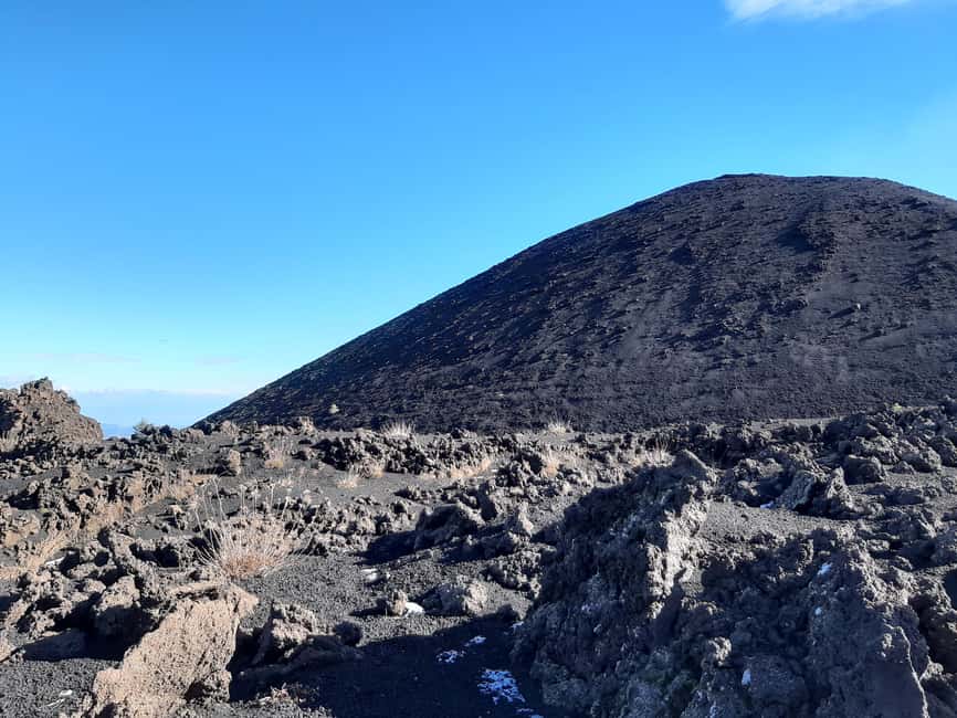 Etna: Jeep excursion and trekking suitable for everyone. Shoes and jacket provided free of charge. - Going under the lava flow at Grotta delle Nevi
