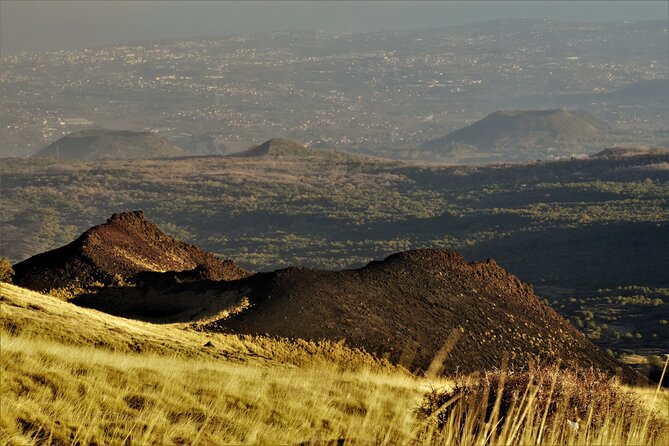 Etna's Hidden Gems - Trek Valle Bove & Lava Tunnel with Gear - Inside a lava tube with helmet and flashlight