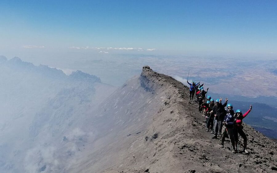 Etna: summit craters trekking with volcano guide 3350mt - Hiking across black lava and loose volcanic sand