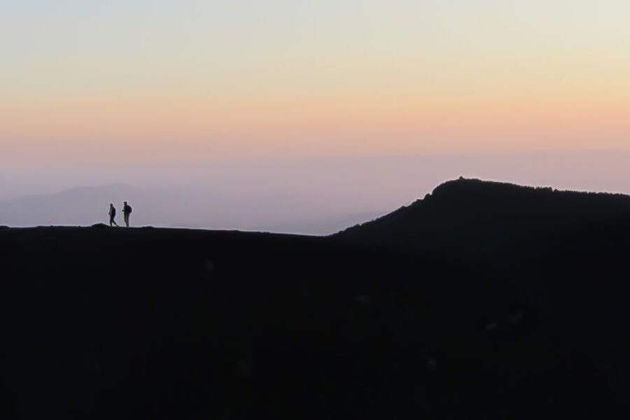 Etna Sunset Tour: Volcano trek, Cave & tasting from Catania - Walking the craters near Rifugio Sapienza