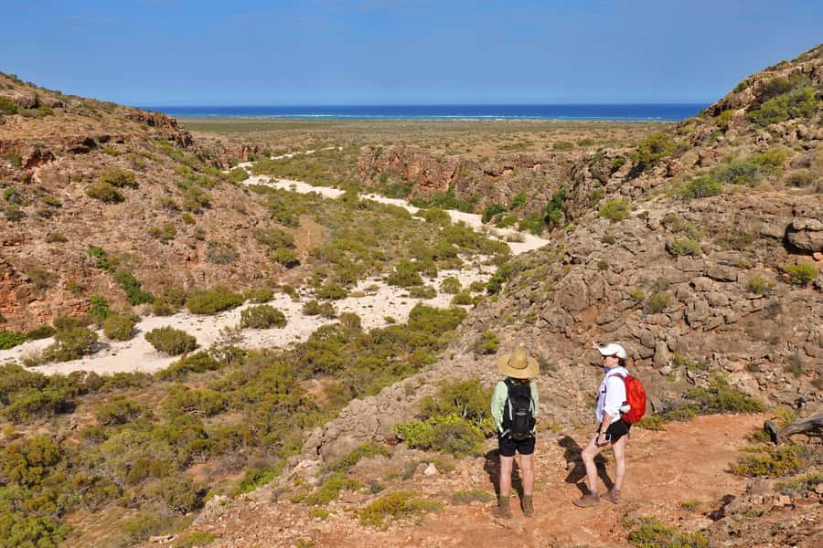 Exmouth: Cape Range Explorer One-Day Trekking Adventure - Cape Range from red rock to reef