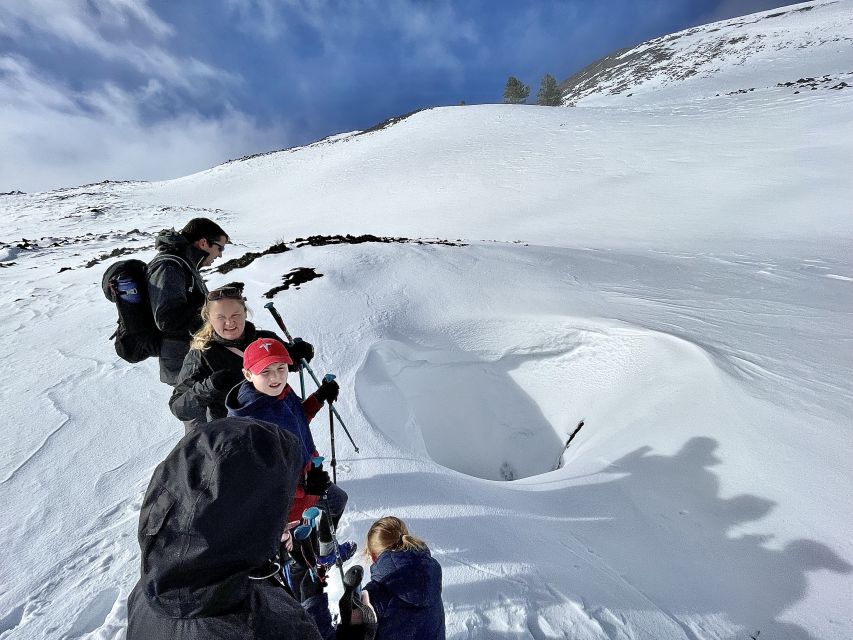Piano Provenzana: Guided Mt. Etna Snowshoeing Trek - Snow and black lava at Piano Provenzana