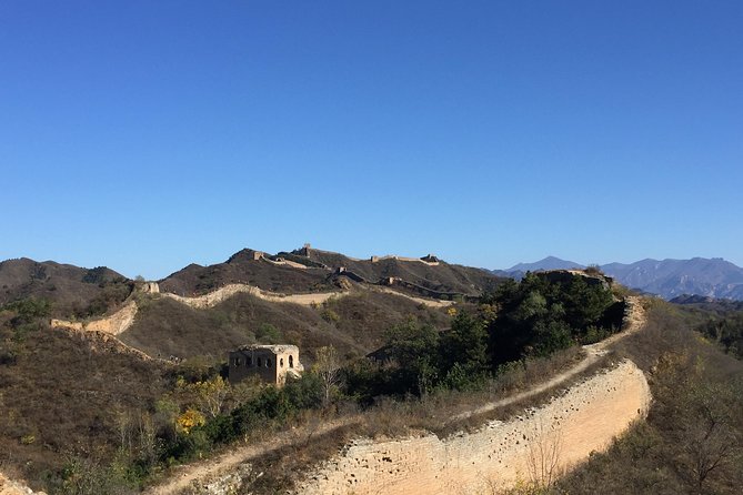 Private Trekking Tour from Gubeikou to Jinshanling Greatwall - The valley crossing shows the wall beyond the postcard